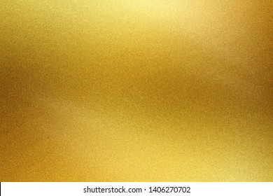 Brushed golden metal foil surface, abstract texture background