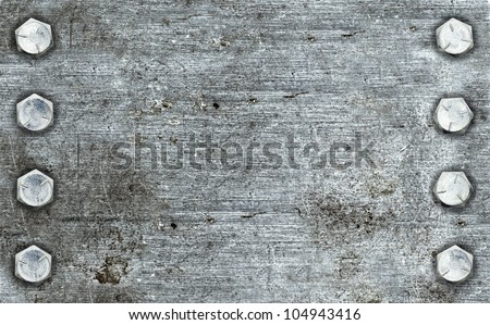 Brushed metal background with two rows of bolts