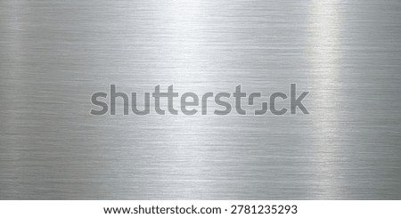 brushed metal surface with a distinct linear texture, featuring shades of silver and gray