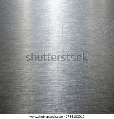 Brushed metal texture, showcasing a soft chrome surface with subtle grunge and scratches. This image provides a raw, industrial background.
