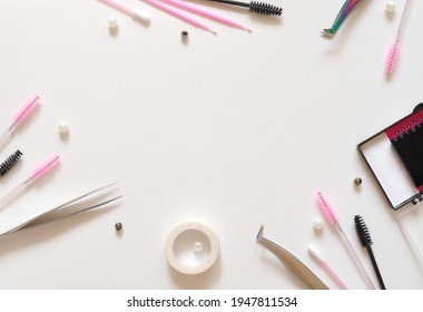 brushes for lash extensions flatlay on white background 