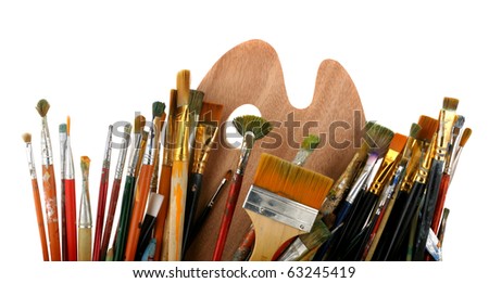 Brushes with a palette isolated on a white background