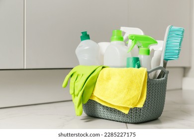 Brushes, sponges, rubber gloves and natural cleaning products in the basket. Eco-friendly cleaning products - Powered by Shutterstock