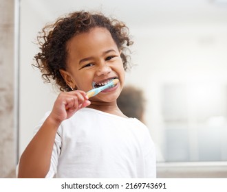 Brushing up before bedtime. Portrait of an adorable little girl brushing her teeth in a bathroom at home. - Shutterstock ID 2169743691