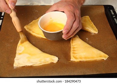 Brushing With Egg Glaze. Making Chocolate Croissants With Puff Pastry