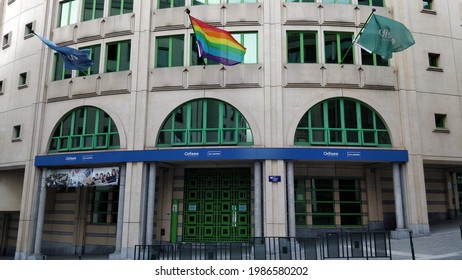 BRUSSELS, BELGIUM - 04 28 2021: A LGBTQ+ Flag Waving On The Building Of Odisee Community College Of KU Leuven In The City Centre