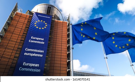 Brussels / Belgium - 11/10/2019 - European Union flags waving in wind in front of European Commission building. Brussels, Belgium.
