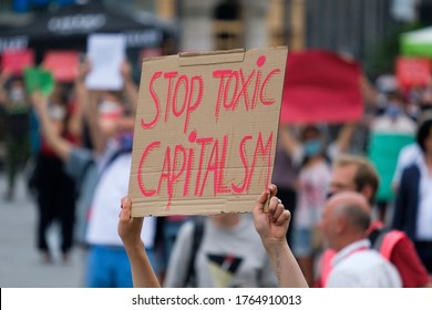Brussels, Belgium. 27th June 2020. Activists hold placards during a protest by Extinction Rebellion climate change activists.