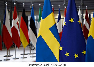 Brussels, Belgium. 5th March 2019. Flag of EU and Sweden stand in European Council offices . - Shutterstock ID 1330169138