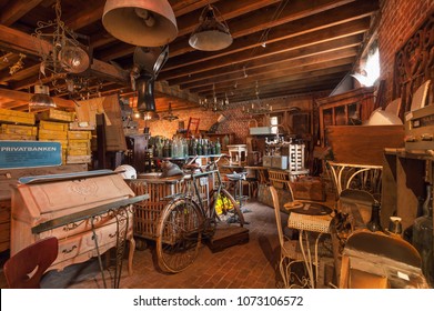 BRUSSELS, BELGIUM - APR 2: Attic of old antique store with many vintage utensil, decor, wooden furniture, retro bicycle and many details on April 2, 2018. More than 1,200,000 people lives in Brussels