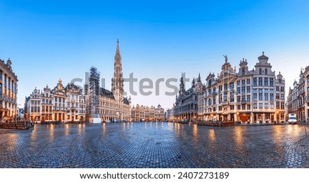 Brussels, Belgium at Grand Place with the Town Hall tower at blue hour.