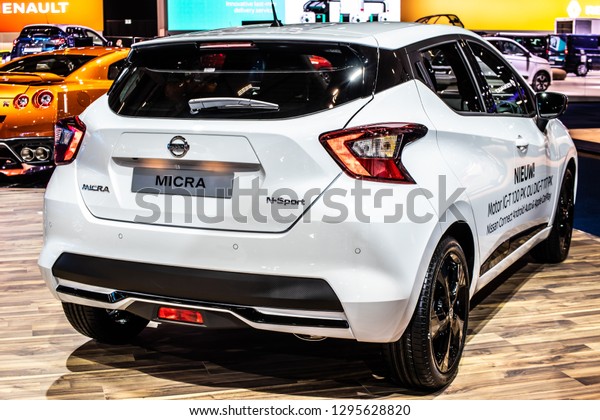 Brussels, Belgium, Jan\
18, 2019: metallic white Nissan Micra at Brussels Motor Show, Fifth\
generation, K14, compact auto produced by Japanese car manufacturer\
Nissan