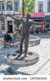 Brussels, Belgium - June 6, 2019: L'Envol statue at place de la Vieille Halle aux Bles. L'Envol is a bronze statue of Belgian singer Jacques Brel.