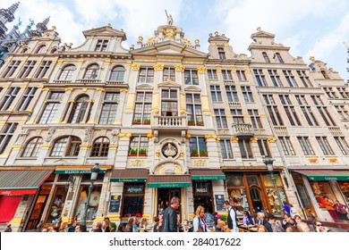 BRUSSELS, BELGIUM - MAY 16, 2015: Historic Guildhalls With Unidentified People At The Grand Place. The Square Is The Most Important Tourist Destination And Memorable Landmark In Brussels