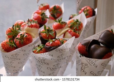 Brussels, Belgium - October 05, 2019: Godiva, Belgian Chocolatier.  Strawberries Dipped Into Godiva Chocolate. Brussels, Belgium.