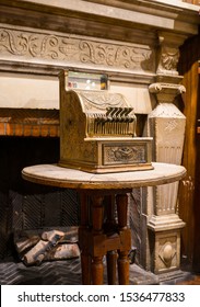 Brussels / Belgium - October 07 2019: Ancient Counting Machine In Front Of Old Fire Place. Decorative Element Of The Interior Of Chocolate Shop. Buttons Above, Drawer Below, Text National On It.