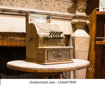 Brussels / Belgium - October 07 2019: Ancient Counting Machine In Front Of Old Fire Place. Decorative Element Of The Interior Of Chocolate Shop. Buttons Above, Drawer Below, Text National On It.