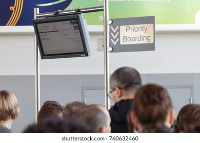 Brussels, Belgium. October 27 2017. Screen With A Scheduled Flight To Vienna And Priority Boarding Sign At Zaventem Brussels Airport.