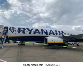 Brussels, Belgium - September 25, 2022: Low Cost, Budget Irish Airlines Ryanair Plane At Brussels Zaventem Airport. People Leaving Airplane After Arrival. Logo, Emblem And Name On Plane Side