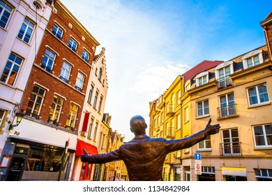 Brussels (Bruxelles), Belgium - March 21, 2018 - Place de la Vieille Halle aux Bles with statue of the famous singer Jacques Brel, which entitled L'envol (The Flight)