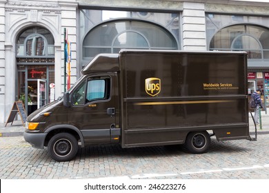 BRUSSELS - JULY 30: UPS truck in the street on July 30, 2014  in Brussels. UPS is one of largest package delivery companies worldwide with 397,100 employees and USD 54.1 billion revenue (2012).