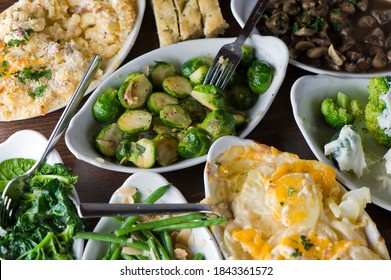 Brussels sprouts, green beans and mashed potatoes. Sautéed vegetables in olive oil, herbs, spices and salt and pepper. Classic American steakhouse, restaurant or bistro side dish.