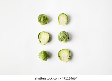 Brussels sprouts on white background. Seasonal vegetables in hipster style pattern
