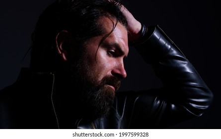 Brutal bearded man in leather jacket. Silhouette of handsome man. Mens beauty, fashion.