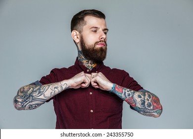 Brutal handsome man with tattooed body