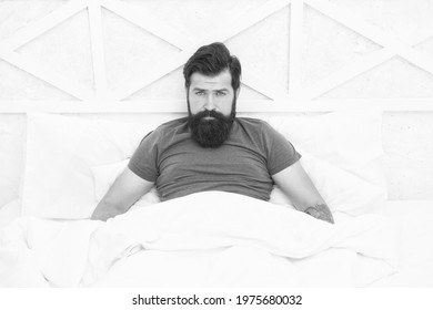 Brutal Male Spending Time In Room. Relax Lifestyle Concept. Bearded Man In Bed. Wake Up At Morning. Bachelor Feel Comfortable. Guy Single At Bedroom. Lazy Sunday. Bed Time Routine