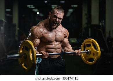 Brutal Strong Athletic Men Pumping Muscles Stock Photo Shutterstock