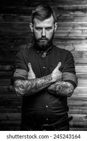 Brutal Tattooed Man With Full Seriousness Look