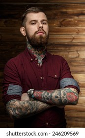 Brutal Tattooed Man With Full Seriousness Look