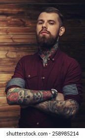 Brutal Tattooed Man With Full Seriousness Look