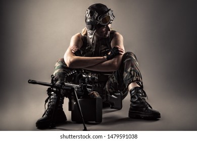 Brutal Woman Sitting On Floor With Machine Gun 