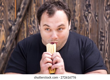 Brutal Young Man Eating A Hot Dog