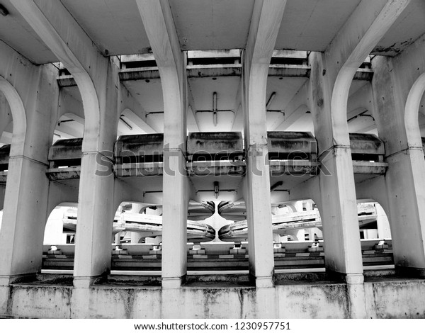Brutalist garage\
ramp | Concrete structure garage ramp | Linear architecture\
concrete structure | Noissy leGrand brutalism parking | black and\
white brutalist french parking\
structure
