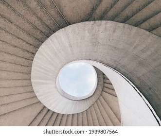 Brutalist spiral staircase with a view of the sky located in Warsaw, Poland - Powered by Shutterstock