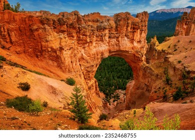 Bryce Canyon National Park: Natural Bridge at sunlight with blue sky - Powered by Shutterstock