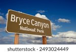 Bryce Canyon National Park (Utah) Road Sign Against Blue Sky and Clouds.