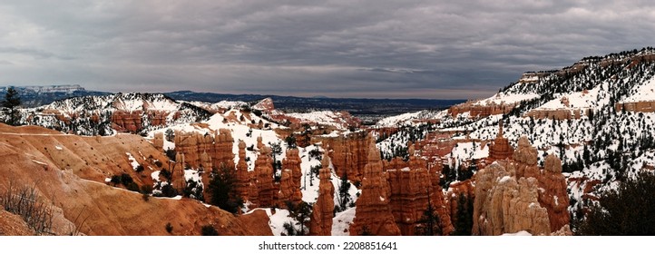 Bryce Canyon Panorama In Overcast Winter Day With Orange Rocks And Snow