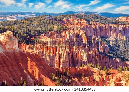 Bryce Canyon in the USA. Giant natural amphitheater created by erosion. Hoodoos are unique geological structures formed by erosion. Incredible landscape illuminated by the sunset