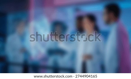 bstract blurred background featuring a group of diverse medical researchers or scientists studying data visualization on a large digital screen. Ideal corporate backdrop for innovation centers and deep tech collaboration.