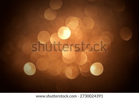 bstract bokeh background featuring blurred city night lights and glowing Christmas decorations for a festive holiday celebration on a dark defocused street
