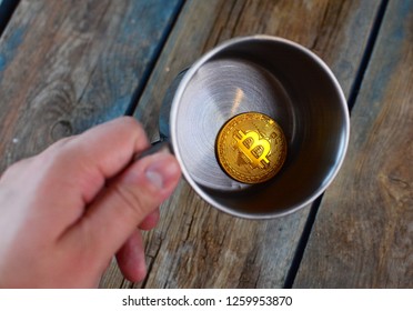 BTC Symbol. Bitcoin At The Bottom Of The Metal Cup. Bitcoin Falling And Shattered Dreams About The Wealth Concept. 