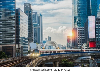 BTS Skytrain, Electric train, running on the way with business office buildings on the background. - Shutterstock ID 2047647392