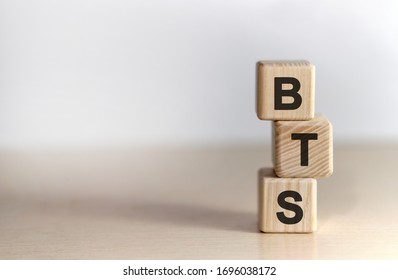 BTS - text on wooden cubes, on white background