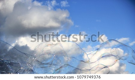 bubble bubbles floating soap drift in blue sky with clouds stock, photo, photograph, picture, image