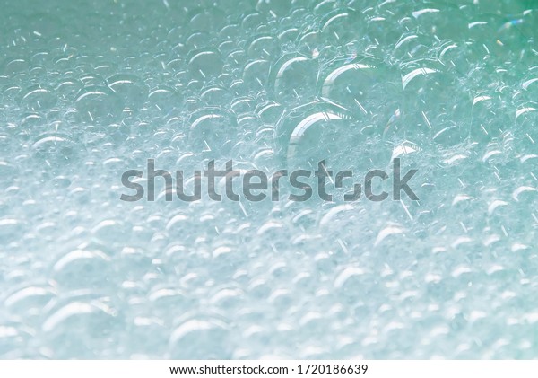 Bubble of car wash in water tank for background\
and texture