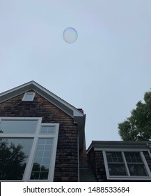 A Bubble Floating Over a House